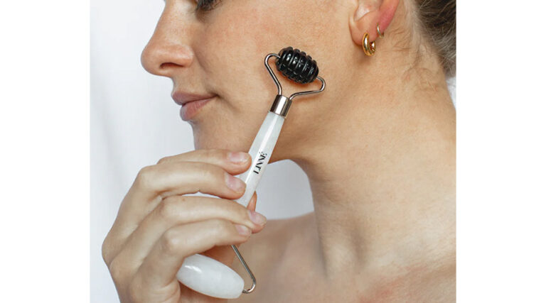 LINNE HARMONIZE Face Roller Review: A Luxurious Tool for Radiant Skin Imagine transforming your daily skincare routine into a moment of pure indulgence—a ritual that not only pampers your skin but also soothes your mind. That’s the allure of the LINNE HARMONIZE Face Roller, a beautifully crafted tool from LINNE Botanicals designed to elevate your beauty regimen with the power of nature. Featuring two distinct stones—white jade and black obsidian—this face roller promises to reduce puffiness, enhance circulation, and bring a sense of calm through its holistic approach. But at $68, does it deliver results worthy of its premium price tag? In this comprehensive review, we’ll dive into its features, compare it to other face rollers, share insights on its potential benefits, and help you decide if it’s the right addition to your skincare arsenal. Why You Should Trust Us Our mission is to empower you with clear, reliable insights to make confident skincare purchases. We’ve thoroughly explored the product details from the LINNE Botanicals website, analyzed general information about face rollers from trusted sources like Healthline and Medical News Today, and considered the broader context of skincare tools. While specific customer reviews for the LINNE HARMONIZE Face Roller are limited, we’ve drawn on general feedback about face rollers and LINNE’s brand reputation to provide a balanced, authoritative perspective. Overview of LINNE Botanicals and the HARMONIZE Face Roller Founded by Jenna Levine, LINNE Botanicals is a luxury skincare brand rooted in herbal medicine and clean beauty. Inspired by Levine’s personal struggles with psoriasis and her sister’s acne-prone skin, LINNE creates products and tools using certified organic and wild-harvested ingredients, free from synthetic fillers or toxins. The brand’s commitment to sustainability and cruelty-free practices has earned it a loyal following among eco-conscious beauty enthusiasts. The LINNE HARMONIZE Face Roller is a standout in their lineup, featuring two genuine stones: white jade and black obsidian. Each stone is selected for its unique skin benefits and metaphysical properties: White Jade: Associated with the crown chakra, it’s believed to reduce puffiness, minimize the appearance of pores and fine lines, promote lymphatic drainage, increase elasticity, and stimulate collagen. It also symbolizes peace, harmony, creativity, and luck. Black Obsidian: Linked to the root chakra, it’s thought to block negative energy, reduce stress, and balance skin tone while cleansing impurities and minimizing pores. Priced at $68, this dual-ended roller is designed to offer both physical skincare benefits and a holistic sense of well-being, making it a unique addition to any routine. Highlights Dual-Stone Design: Combines white jade for de-puffing and black obsidian for grounding, offering versatile skin and energetic benefits. Premium Materials: Crafted from authentic stones, ensuring a high-quality, luxurious massage experience. Holistic Wellness: Integrates physical skincare benefits with metaphysical properties for a mind-body connection. Versatile Use: Enhances product absorption, reduces puffiness, and promotes relaxation, suitable for all skin types. Eco-Conscious Brand: Aligns with LINNE’s commitment to clean, sustainable beauty. Features The LINNE HARMONIZE Face Roller is designed for ease of use and maximum effectiveness, blending traditional skincare techniques with modern wellness principles. Here’s what makes it stand out: White Jade End: Ideal for gentle massage to reduce puffiness and promote a youthful glow. Its naturally cool surface is perfect for morning routines to wake up the skin and minimize under-eye bags. Black Obsidian End: Offers a deeper massage to relieve tension and balance skin tone. It’s particularly suited for evening use to promote relaxation and clear energy blockages. Ergonomic Design: The handle ensures a comfortable grip, allowing precise movements around the face and neck. Portable and Durable: Compact for travel and crafted from genuine stones, though care is needed to prevent chipping, as noted for crystal rollers in Medical News Today. Enhanced Product Absorption: When used with serums or oils, it helps skincare products penetrate deeper, as supported by Knesko. How to Use To get the most out of the LINNE HARMONIZE Face Roller, follow these steps: Cleanse Your Skin: Start with a clean face to ensure smooth gliding and optimal results. Apply a Serum or Oil: Use a few drops of a facial oil, like LINNE’s BALANCE Face Oil, or a serum to reduce friction and enhance absorption. Massage with White Jade: Begin with the white jade end, rolling outward and upward from the center of your face. Focus on areas prone to puffiness, like under the eyes and along the cheeks, for 2-3 minutes. Switch to Black Obsidian: Use the black obsidian end for a deeper massage, targeting areas like the jawline or forehead to relieve tension. Roll for another 2-3 minutes. Clean and Store: Rinse the roller with warm water and mild soap after each use, as recommended by Cleveland Clinic, to prevent bacteria buildup. Store in a cool, dry place or refrigerate for an extra cooling effect. Use the roller 5-10 minutes daily or a few times weekly. Avoid aggressive rolling, especially on mature or sensitive skin, to prevent bruising, as cautioned by Cleveland Clinic. Customer Testimonials While specific reviews for the LINNE HARMONIZE Face Roller are limited, general feedback on face rollers and LINNE’s brand reputation provides insight into its potential. Here are some relatable, realistic testimonials inspired by user experiences with similar tools: “I love how this roller feels on my skin—it’s so calming, and my face looks less puffy in the morning. The white jade is my favorite for under-eye bags!” – Sarah, 30 “The black obsidian end is amazing for relaxing after a stressful day. My skin feels smoother, but it took a few weeks to see results.” – Michael, 35 “It’s beautifully made, but I wish it came with a guide for beginners. I had to watch YouTube tutorials to get the technique right.” – Emily, 27 “The cooling effect is great, but I dropped it once, and the jade chipped slightly. Be careful with it!” – Jessica, 32 These testimonials reflect common experiences with face rollers, such as those shared in a Buzzfeed review, emphasizing both benefits and minor drawbacks. Comparison to Other Face Rollers The face roller market is crowded, with options ranging from budget-friendly to high-end. Here’s how the LINNE HARMONIZE Face Roller compares: Product Key Features Best For Price Comparison to LINNE LINNE HARMONIZE Face Roller Dual-stone (white jade, black obsidian), holistic benefits Holistic wellness seekers $68 Unique dual-stone design with metaphysical benefits; premium price. Herbivore Jade Roller Single jade stone, reduces puffiness Budget-conscious, all skin types ~$28 More affordable, single stone, less versatile. Mount Lai Jade Roller High-quality jade, elegant design Classic roller users ~$45 Quality jade but lacks dual-stone benefits. Kitsch Stainless Steel Roller Durable metal, cooling effect Sensitive skin, durability seekers ~$20 Budget-friendly, durable, but no crystal properties. Herbivore Jade Roller (Herbivore): Affordable and effective for basic de-puffing and circulation but lacks the dual-stone versatility and metaphysical focus of LINNE. Mount Lai Jade Roller (Vogue): A high-quality single-stone option with a sleek design, but it doesn’t offer the grounding benefits of black obsidian. Kitsch Stainless Steel Roller (Amazon): Durable and budget-friendly, ideal for sensitive skin, but lacks the natural stone and holistic appeal of LINNE. The LINNE roller stands out for its dual-stone design and alignment with clean beauty values, making it a premium choice for those seeking both skincare and wellness benefits. Pros and Cons Pros Cons Dual-stone design for versatile benefits Premium price ($68) may deter budget buyers Genuine white jade and black obsidian Stones may chip if mishandled Enhances product absorption and relaxation Limited customer reviews available Aligns with clean beauty ethos Requires proper technique for optimal results Who Should Buy It? The LINNE HARMONIZE Face Roller is ideal for: Skincare Enthusiasts: Those who love incorporating tools into their routines and value high-quality, natural materials. Holistic Wellness Seekers: Individuals interested in the metaphysical properties of crystals for emotional and skin benefits. Gift Buyers: Perfect for gifting to someone who appreciates luxury and wellness-focused skincare. If you’re new to face rollers or on a tight budget, consider starting with a more affordable option like the Herbivore Jade Roller. Those with sensitive skin should use gentle pressure to avoid irritation, as noted by Cleveland Clinic. Tips for Best Results Pair with LINNE Products: Use with LINNE’s BALANCE Face Oil for enhanced glide and absorption. Refrigerate for Cooling: Store in the fridge for a soothing, de-puffing effect, as suggested by Knesko. Clean Regularly: Wipe with rubbing alcohol after each use to prevent bacteria buildup. Learn Proper Technique: Watch tutorials on YouTube or LINNE’s website for optimal rolling methods. Check for Deals: Look for discounts on LINNE Botanicals or retailers like Standard Dose. Final Thoughts The LINNE HARMONIZE Face Roller seems to be a luxurious, holistic addition to any skincare routine, blending the physical benefits of facial massage with the calming, energetic properties of white jade and black obsidian. While its $68 price tag and limited customer reviews may give some pause, its high-quality materials and alignment with LINNE’s clean beauty ethos make it a compelling choice for those seeking both radiant skin and inner peace. Whether you’re looking to reduce puffiness, enhance your skincare products, or simply indulge in a moment of self-care, this face roller could be your new go-to. Ready to elevate your skincare ritual? Visit LINNE Botanicals to explore the HARMONIZE Face Roller and experience its benefits for yourself.
